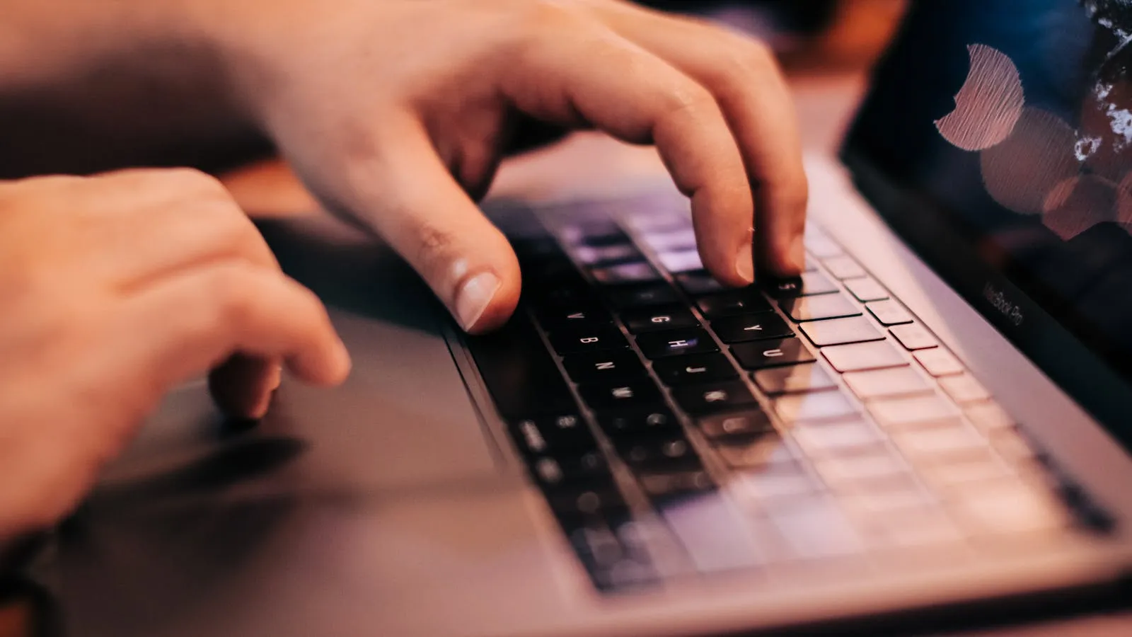 Person using a laptop with keyboard — accessibility and inclusion